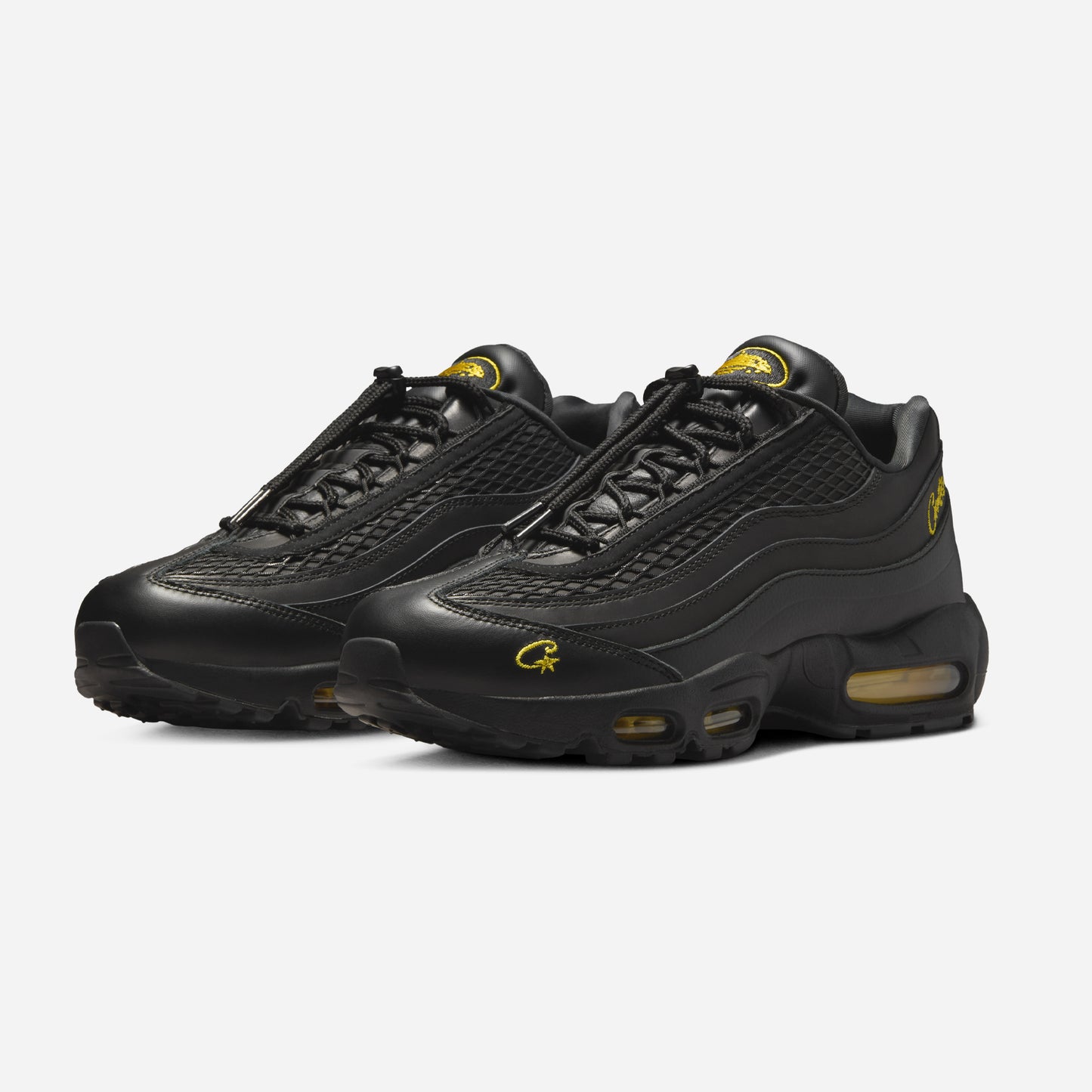 Pantofi sport Nike Air Max 95 x Corteiz Honey Black în negru cu detalii galbene și design modern