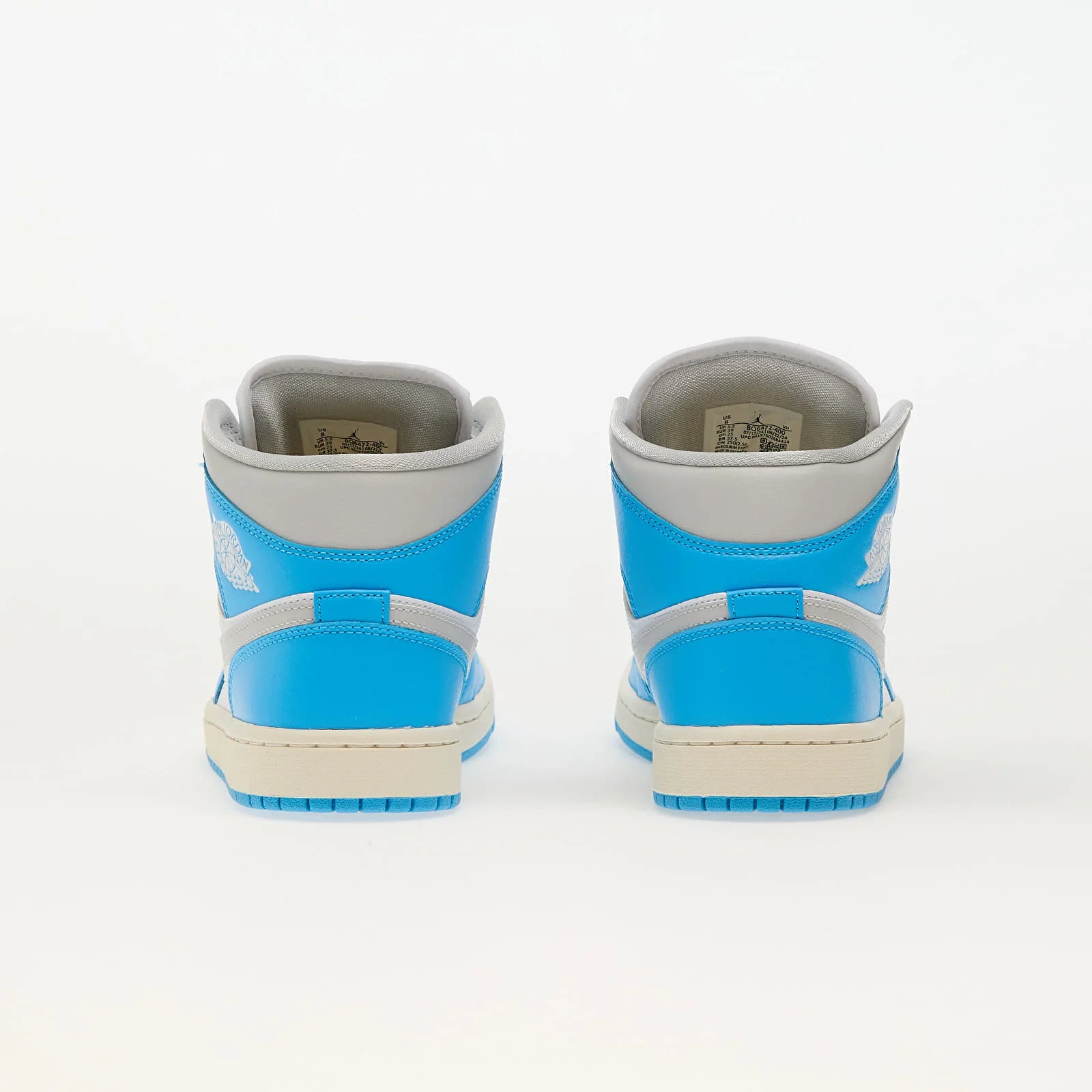 Pantofi sport Air Jordan 1 Mid Dk Powder Blue Neutral Grey White văzuți din spate cu detalii albastre și gri
